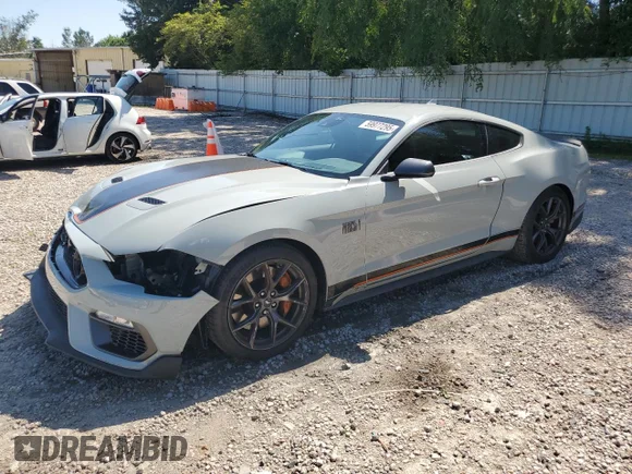 ✅ 2021 Ford Mustang Mach 1 • VIN: 1FA6P8R04M5551165 • Lot: 59977295. Listed on Copart with 11,739 mi. Free auction sales archive from the USA and detailed vehicle history report at DreamBid. Image 1.