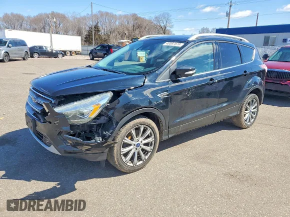 ✅ 2017 Ford Escape Titanium • VIN: 1FMCU9J9XHUA61570 • Lot: 48597876. Wystawiony na Copart z przebiegiem 198 245 mil. Bezpłatny archiwum sprzedaży aukcyjnych z USA i szczegółowy raport historii pojazdu na DreamBid. Zdjęcie 1.