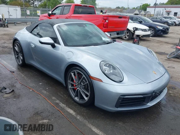 ✅ 2020 Porsche 911 Carrera S • VIN: WP0CB2A97LS262106 • Lot: 42011151. Listed on IAAI with 63,444 mi. Free auction sales archive from the USA and detailed vehicle history report at DreamBid. Image 1.