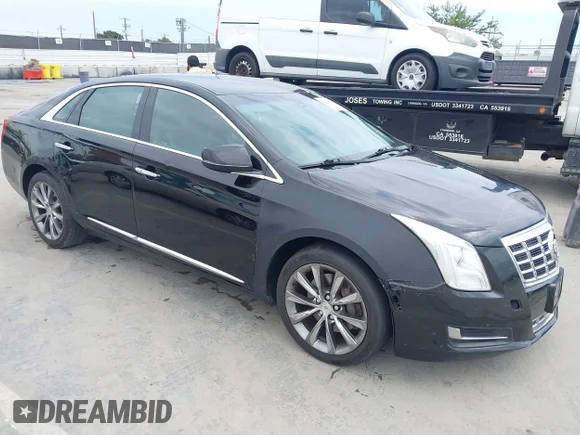 ✅ 2013 Cadillac XTS Livery • VIN: 2G61W5S39D9106615 • Лот: 45132530. Опубликован ранее на IAAI с пробегом 199 080 миль. Бесплатный доступ к архиву аукционных продаж из США и подробный отчёт об истории автомобиля на DreamBid. Изображение 1.