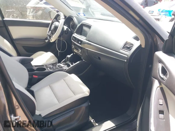 ✅ 2016 Mazda CX-5 Grand Touring • VIN: JM3KE2DY3G0703020 • Лот: 45499731. Опубликован ранее на IAAI с пробегом 145 735 миль. Бесплатный доступ к архиву аукционных продаж из США и подробный отчёт об истории автомобиля на DreamBid. Изображение 5.
