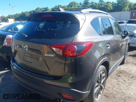 ✅ 2016 Mazda CX-5 Grand Touring • VIN: JM3KE4DY8G0627306 • Lot: 43098428. Wystawiony na IAAI z przebiegiem 74 370 mil. Bezpłatny archiwum sprzedaży aukcyjnych z USA i szczegółowy raport historii pojazdu na DreamBid. Zdjęcie 4.