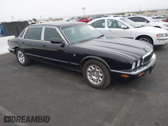 ✅ 1999 Jaguar XJ • VIN: SAJHD6046XC866745 • Lot: 43270860. Listed on IAAI with 214,165 mi. Free auction sales archive from the USA and detailed vehicle history report at DreamBid. Image 1.