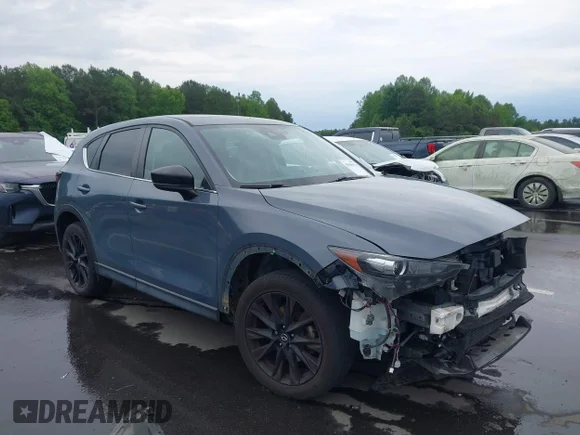 ✅ 2021 Mazda CX-5 Carbon Edition • VIN: JM3KFBCY7M0339467 • Lot: 45016971. Wystawiony na IAAI z przebiegiem 63 247 mil. Bezpłatny archiwum sprzedaży aukcyjnych z USA i szczegółowy raport historii pojazdu na DreamBid. Zdjęcie 1.