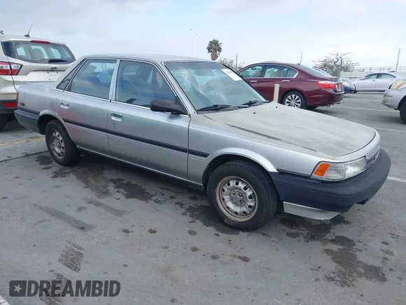 ✅ 1990 Toyota Camry • VIN: 4T1SV24E0LU190211 • Лот: 42368986. Опубликован ранее на IAAI с пробегом 145 167 миль. Бесплатный доступ к архиву аукционных продаж из США и подробный отчёт об истории автомобиля на DreamBid. Изображение 1.