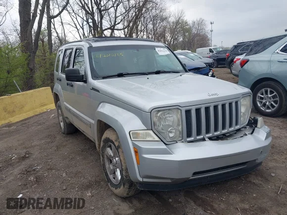 ✅ 2010 Jeep Liberty Sport • VIN: 1J4PN2GK7AW167466 • Lot: 42012135. Listed on IAAI with 164,108 mi. Free auction sales archive from the USA and detailed vehicle history report at DreamBid. Image 1.