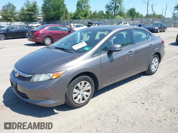 ✅ 2012 Honda Civic LX • VIN: 19XFB2F57CE377164 • Лот: 45141060. Опубликован ранее на IAAI с пробегом 242 027 миль. Бесплатный доступ к архиву аукционных продаж из США и подробный отчёт об истории автомобиля на DreamBid. Изображение 2.