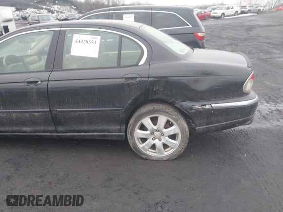 ✅ 2005 Jaguar X-Type 3.0L • VIN: SAJWA51AX5WE57144 • Lot: 44428553. Wystawiony na IAAI z przebiegiem 78 274 mil. Bezpłatny archiwum sprzedaży aukcyjnych z USA i szczegółowy raport historii pojazdu na DreamBid. Zdjęcie 6.