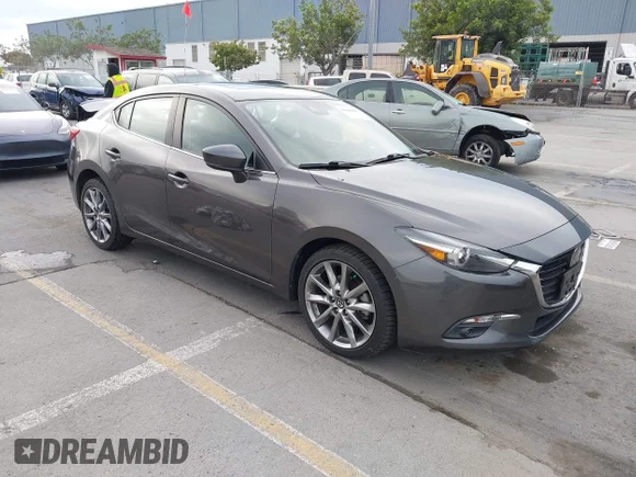 ✅ 2018 Mazda 3 Grand Touring • VIN: 3MZBN1W33JM228426 • Lot: 43668039. Listed on IAAI with 50,638 mi. Free auction sales archive from the USA and detailed vehicle history report at DreamBid. Image 1.