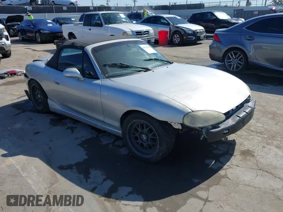 ✅ 2002 Mazda MX-5 Miata Cloth • VIN: JM1NB353820231865 • Lot: 44375408. Listed on IAAI with 205,083 mi. Free auction sales archive from the USA and detailed vehicle history report at DreamBid. Image 1.