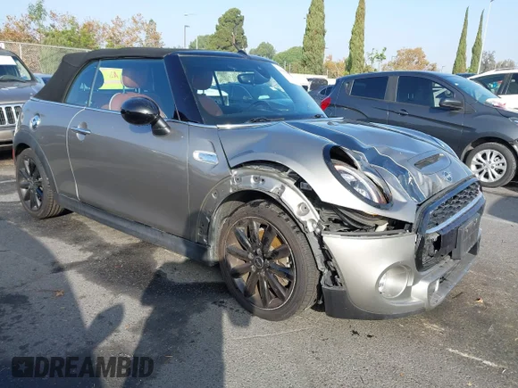 ✅ 2019 MINI Convertible Cooper S • VIN: WMWWG9C57K3E39618 • Lot: 43654061. Listed on IAAI with 52,508 mi. Free auction sales archive from the USA and detailed vehicle history report at DreamBid. Image 1.