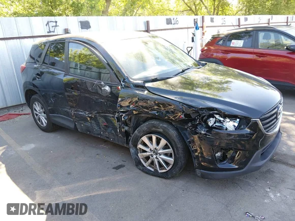 ✅ 2016 Mazda CX-5 Sport • VIN: JM3KE2BE6G0877155 • Lot: 45378283. Listed on IAAI with 131,582 mi. Free auction sales archive from the USA and detailed vehicle history report at DreamBid. Image 1.