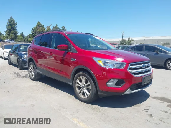 ✅ 2018 Ford Escape SE • VIN: 1FMCU0GDXJUD57198 • Lot: 45275623. Listed on IAAI with 86,052 mi. Free auction sales archive from the USA and detailed vehicle history report at DreamBid. Image 1.