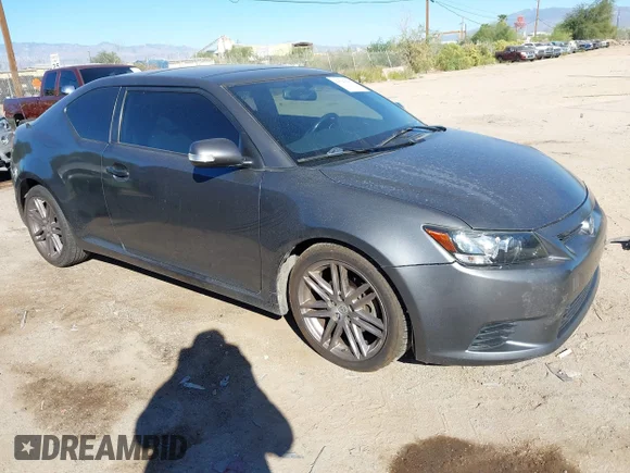 ✅ 2012 Scion tC Release Series 7.0 • VIN: JTKJF5C73C3040903 • Lot: 43541097. Listed on IAAI with 164,325 mi. Free auction sales archive from the USA and detailed vehicle history report at DreamBid. Image 1.