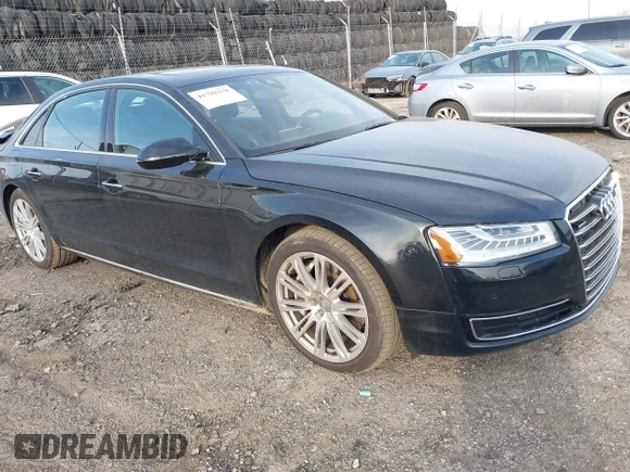✅ 2015 Audi A8 3.0T • VIN: WAU3GAFDXFN028244 • Lot: 41791578. Listed on IAAI with 149,770 mi. Free auction sales archive from the USA and detailed vehicle history report at DreamBid. Image 1.