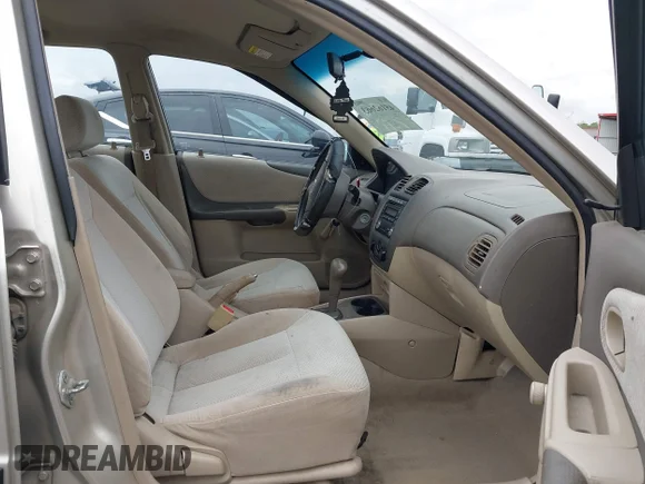 ✅ 2003 Mazda Protege DX • VIN: JM1BJ225030176285 • Lot: 45162663. Listed on IAAI with 109,758 mi. Free auction sales archive from the USA and detailed vehicle history report at DreamBid. Image 5.