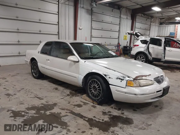 ✅ 1997 Mercury Cougar • VIN: 1MELM62W3VH618474 • Lot: 44203858. Listed on IAAI with 94,346 mi. Free auction sales archive from the USA and detailed vehicle history report at DreamBid. Image 1.