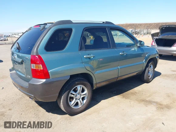 ✅ 2005 Kia Sportage LX • VIN: KNDJF723157115207 • Lot: 42888256. Wystawiony na IAAI z przebiegiem 165 802 mil. Bezpłatny archiwum sprzedaży aukcyjnych z USA i szczegółowy raport historii pojazdu na DreamBid. Zdjęcie 4.