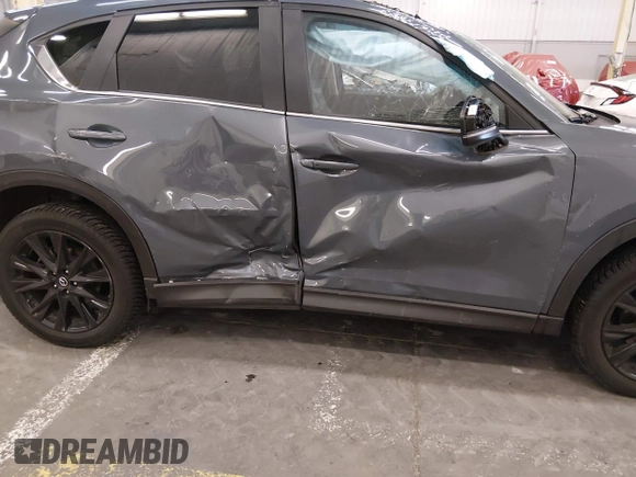 ✅ 2021 Mazda CX-5 Carbon Edition • VIN: JM3KFBCY7M0345821 • Lot: 44927287. Wystawiony na IAAI z przebiegiem 65 534 mil. Bezpłatny archiwum sprzedaży aukcyjnych z USA i szczegółowy raport historii pojazdu na DreamBid. Zdjęcie 6.