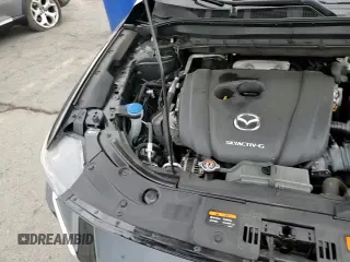 ✅ 2021 Mazda CX-5 Sport • VIN: JM3KFBBM7M0350581 • Лот: 80955655. Опубликован ранее на Copart с пробегом 56 344 миль. Бесплатный доступ к архиву аукционных продаж из США и подробный отчёт об истории автомобиля на DreamBid. Изображение 14.