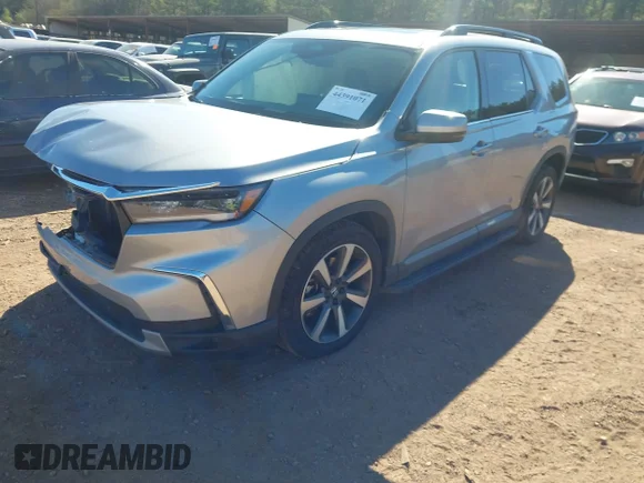 ✅ 2024 Honda Pilot Touring • VIN: 5FNYG1H74RB007103 • Lot: 44391071. Listed on IAAI with 48,021 mi. Free auction sales archive from the USA and detailed vehicle history report at DreamBid. Image 2.