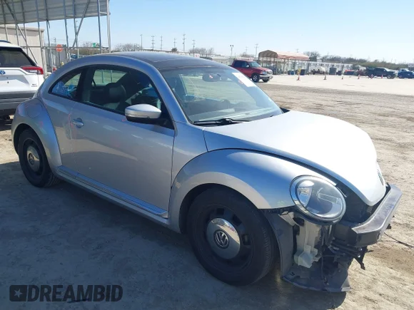✅ 2013 Volkswagen Beetle 2.5L w/Sun/Sound/Nav • VIN: 3VWJX7AT3DM663774 • Лот: 41738146. Опубликован ранее на IAAI с пробегом 98 064 миль. Бесплатный доступ к архиву аукционных продаж из США и подробный отчёт об истории автомобиля на DreamBid. Изображение 1.
