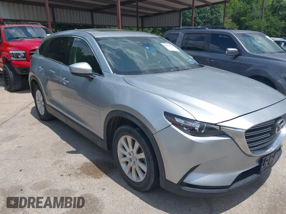 ✅ 2016 Mazda CX-9 Touring • VIN: JM3TCACY7G0124229 • Lot: 45274090. Listed on IAAI with 137,963 mi. Free auction sales archive from the USA and detailed vehicle history report at DreamBid. Image 1.