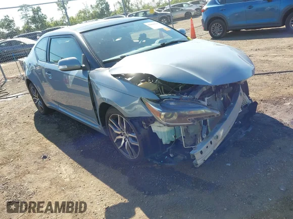✅ 2016 Scion tC • VIN: JTKJF5C71GJ015130 • Lot: 43068144. Wystawiony na IAAI z przebiegiem 74 732 mil. Bezpłatny archiwum sprzedaży aukcyjnych z USA i szczegółowy raport historii pojazdu na DreamBid. Zdjęcie 1.