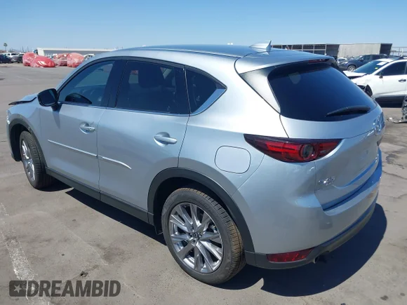 ✅ 2021 Mazda CX-5 Grand Touring Reserve • VIN: JM3KFBAY5M0381770 • Лот: 45323174. Опубликован ранее на IAAI с пробегом 23 434 миль. Бесплатный доступ к архиву аукционных продаж из США и подробный отчёт об истории автомобиля на DreamBid. Изображение 3.