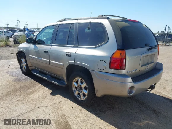 ✅ 2003 GMC Envoy SLT • VIN: 1GKDT13S732288883 • Лот: 45164376. Опубліковано раніше на IAAI з пробігом 243 431 миль. Безкоштовний доступ до архіву аукціонних продажів зі США та докладний звіт про історію автомобіля на DreamBid. Зображення 3.
