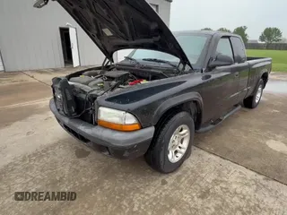 2004 Dodge Dakota z VIN 1D7GL12K94S552459, wystawiony jako Copart lot #52153335 z przebiegiem 128 148 mil mil oraz Czysty tytuł • Clean title. Historia ofert i sprzedaży dostępna na DreamBid. Obrazek 11.