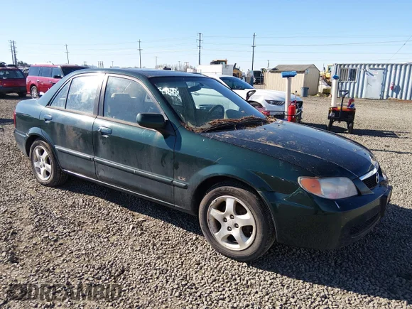 ✅ 2002 Mazda Protege DX • VIN: JM1BJ226920495739 • Лот: 44592401. Опубликован ранее на IAAI с пробегом 283 378 миль. Бесплатный доступ к архиву аукционных продаж из США и подробный отчёт об истории автомобиля на DreamBid. Изображение 1.