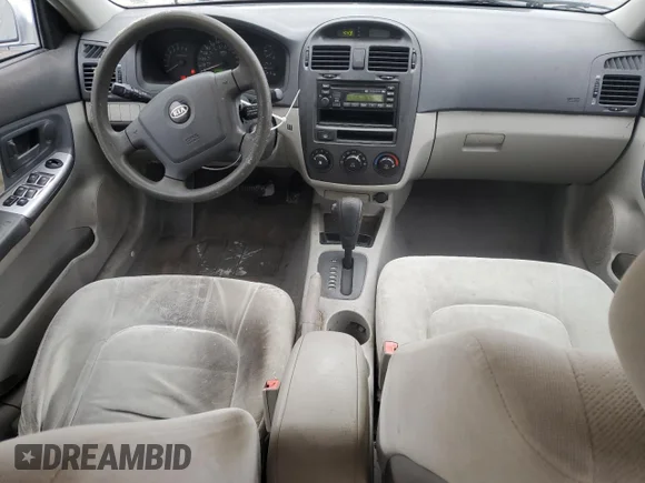 ✅ 2004 Kia Spectra LX • VIN: KNAFE121X45010855 • Лот: 42125315. Опубликован ранее на Copart с пробегом 150 795 миль. Бесплатный доступ к архиву аукционных продаж из США и подробный отчёт об истории автомобиля на DreamBid. Изображение 8.