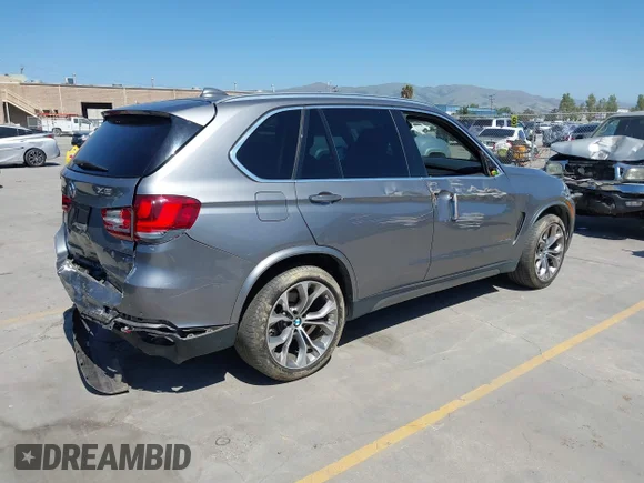 ✅ 2016 BMW X5 xDrive40e • VIN: 5UXKT0C55G0S78988 • Lot: 45084348. Listed on IAAI with 105,600 mi. Free auction sales archive from the USA and detailed vehicle history report at DreamBid. Image 4.