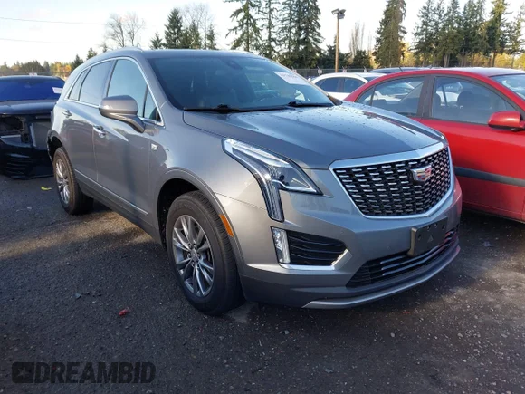 ✅ 2021 Cadillac XT5 AWD Premium Luxury • VIN: 1GYKNDRS8MZ211478 • Лот: 43740564. Опубликован ранее на IAAI с пробегом 57 705 миль. Бесплатный доступ к архиву аукционных продаж из США и подробный отчёт об истории автомобиля на DreamBid. Изображение 1.