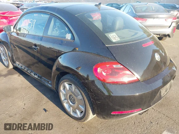 ✅ 2012 Volkswagen Beetle 2.5L w/Sound/Nav PZEV • VIN: 3VWJP7AT7CM661055 • Лот: 41980159. Опубликован ранее на IAAI с пробегом 113 678 миль. Бесплатный доступ к архиву аукционных продаж из США и подробный отчёт об истории автомобиля на DreamBid. Изображение 3.