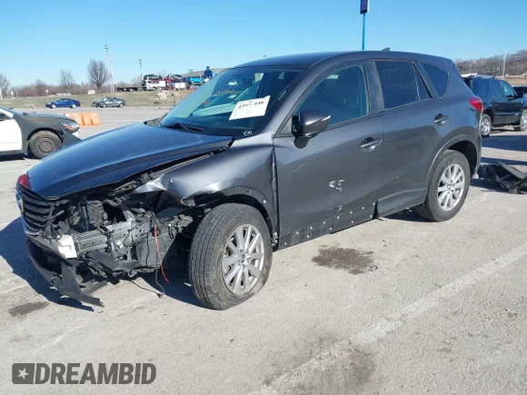 ✅ 2016 Mazda CX-5 Touring • VIN: JM3KE4CY6G0771194 • Lot: 43957446. Wystawiony na IAAI z przebiegiem 69 963 mil. Bezpłatny archiwum sprzedaży aukcyjnych z USA i szczegółowy raport historii pojazdu na DreamBid. Zdjęcie 2.