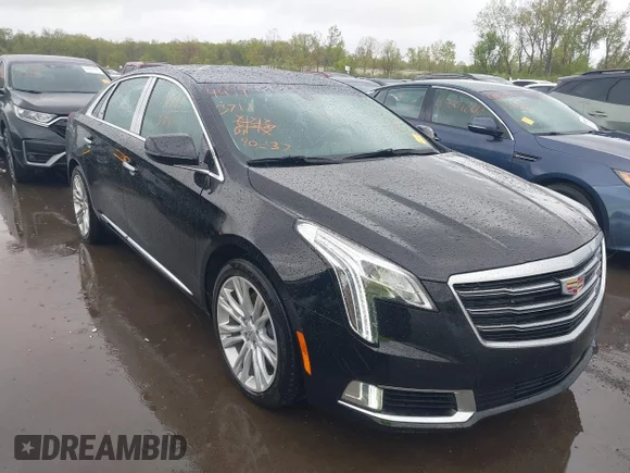 ✅ 2018 Cadillac XTS Luxury • VIN: 2G61N5S30J9169908 • Lot: 44993711. Listed on IAAI with 90,237 mi. Free auction sales archive from the USA and detailed vehicle history report at DreamBid. Image 1.