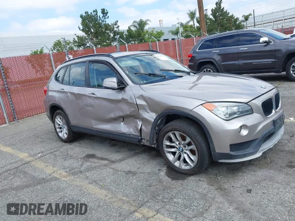 ✅ 2015 BMW X1 xDrive28i • VIN: WBAVL1C55FVY41749 • Lot: 42140979. Listed on IAAI with 120,953 mi. Free auction sales archive from the USA and detailed vehicle history report at DreamBid. Image 1.