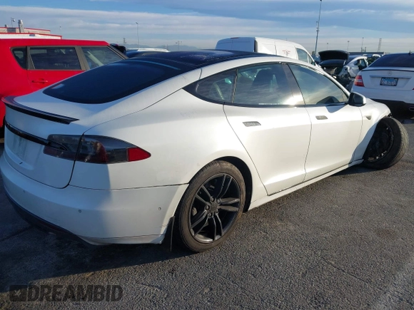 ✅ 2016 Tesla Model S 90D • VIN: 5YJSA1E28GF131436 • Lot: 44125704. Listed on IAAI with 135,536 mi. Free auction sales archive from the USA and detailed vehicle history report at DreamBid. Image 4.