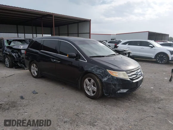 ✅ 2012 Honda Odyssey Touring • VIN: 5FNRL5H97CB103176 • Лот: 44865872. Опубликован ранее на IAAI с пробегом 188 327 миль. Бесплатный доступ к архиву аукционных продаж из США и подробный отчёт об истории автомобиля на DreamBid. Изображение 1.