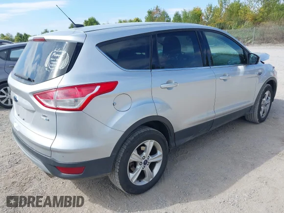 ✅ 2016 Ford Escape SE • VIN: 1FMCU9GX4GUA41917 • Lot: 43235647. Wystawiony na IAAI z przebiegiem 97 567 mil. Bezpłatny archiwum sprzedaży aukcyjnych z USA i szczegółowy raport historii pojazdu na DreamBid. Zdjęcie 4.