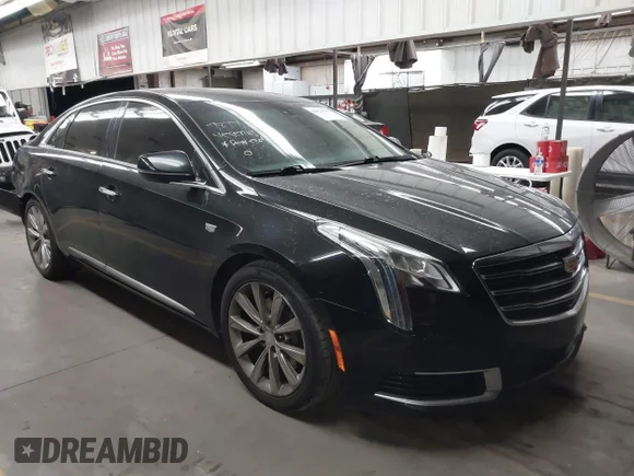 ✅ 2018 Cadillac XTS Livery • VIN: 2G61U5S38J9156441 • Лот: 42624392. Опубликован ранее на IAAI с пробегом 168 650 миль. Бесплатный доступ к архиву аукционных продаж из США и подробный отчёт об истории автомобиля на DreamBid. Изображение 1.