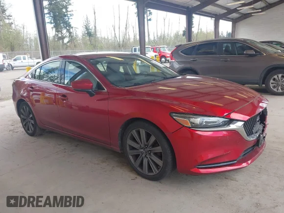 ✅ 2018 Mazda 6 Grand Touring • VIN: JM1GL1TY8J1317968 • Лот: 44834780. Опубліковано раніше на IAAI з пробігом 70 640 миль. Безкоштовний доступ до архіву аукціонних продажів зі США та докладний звіт про історію автомобіля на DreamBid. Зображення 1.