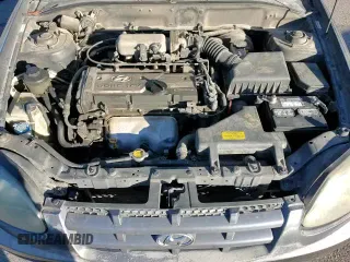 2005 Hyundai Accent GLS z VIN KMHCG45C95U665574, wystawiony jako Copart lot #82603804 z przebiegiem 154 187 mil mil oraz Szkoda całkowita • Salvage title. Historia ofert i sprzedaży dostępna na DreamBid. Obrazek 16.