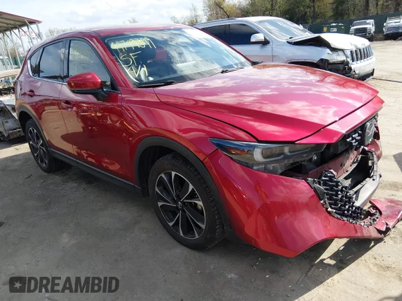 ✅ 2022 Mazda CX-5 S Premium • VIN: JM3KFBDM7N0636090 • Lot: 44749399. Wystawiony na IAAI z przebiegiem 82 987 mil. Bezpłatny archiwum sprzedaży aukcyjnych z USA i szczegółowy raport historii pojazdu na DreamBid. Zdjęcie 1.
