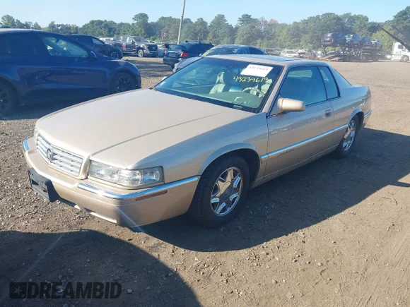 ✅ 1997 Cadillac Eldorado • VIN: 1G6EL12Y4VU602876 • Lot: 43239613. Wystawiony na IAAI z przebiegiem 79 117 mil. Bezpłatny archiwum sprzedaży aukcyjnych z USA i szczegółowy raport historii pojazdu na DreamBid. Zdjęcie 2.