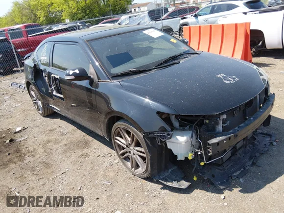 ✅ 2012 Scion tC • VIN: JTKJF5C71C3040799 • Lot: 44764947. Listed on IAAI with 144,173 mi. Free auction sales archive from the USA and detailed vehicle history report at DreamBid. Image 1.