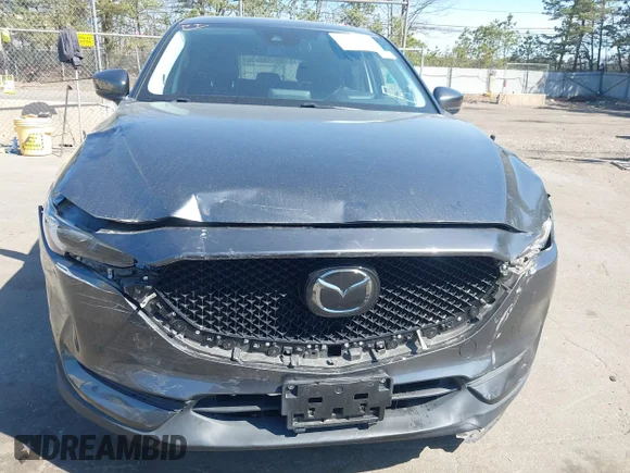 ✅ 2020 Mazda CX-5 Grand Touring • VIN: JM3KFBDM3L0825526 • Lot: 44837409. Listed on IAAI with 29,790 mi. Free auction sales archive from the USA and detailed vehicle history report at DreamBid. Image 6.