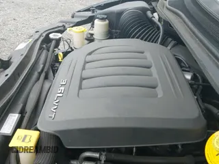 2014 Dodge Grand Caravan SXT z VIN 2C4RDGCG7ER450769, wystawiony jako IAAI lot #42731156 z przebiegiem 85 908 mil mil oraz . Historia ofert i sprzedaży dostępna na DreamBid. Obrazek 19.